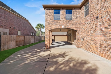 Long driveway with a Porte-Cochere and detached 3-car garage provide plenty of parking.