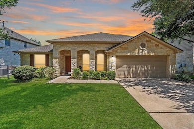 View of front facade featuring concrete driveway,