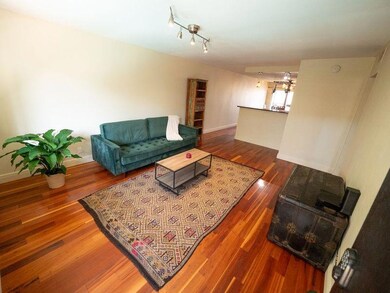 Living room featuring wood finished floors and ba