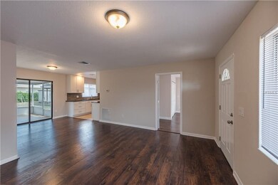 Rich, new laminate flooring in main areas creates 