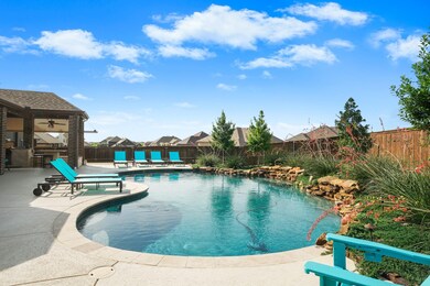 Heated salt water pool with meticulous landscaping