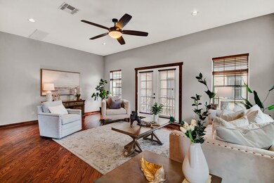 The light-filled living room is anchored by beauti