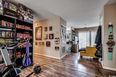 Recreation room featuring hardwood / wood-style fl