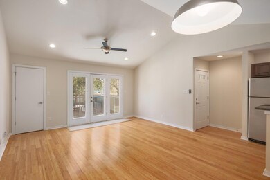 Unfurnished living room with light wood finished 