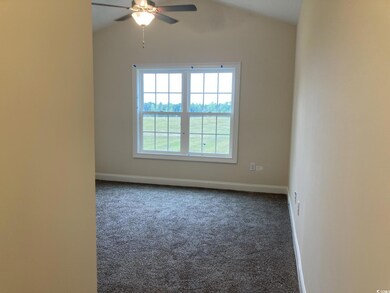 Unfurnished room with carpet, ceiling fan, and lof