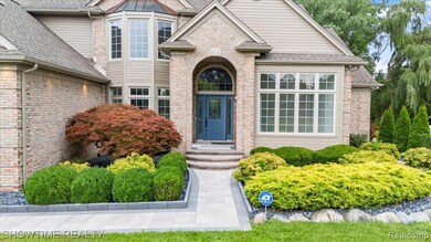 Doorway to property featuring roof with shingles and brick siding