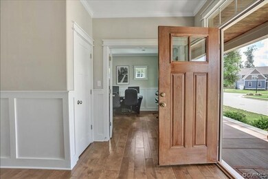 The welcoming foyer showcases the hand-scraped har