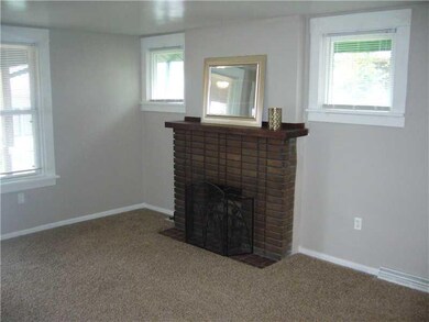 Living Room. Wood burning fireplace in a spacious 