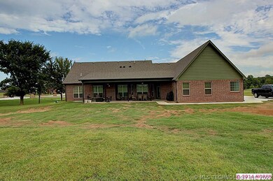 Back of home with patio/entertaining area.  Large
