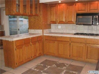 REMODELED KITCHEN VIEW #2 WITH TILE FLOORING WITH 