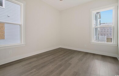 Spare room featuring dark hardwood / wood-style fl