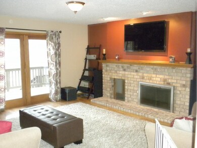 Main floor family with stone wood fireplace that w