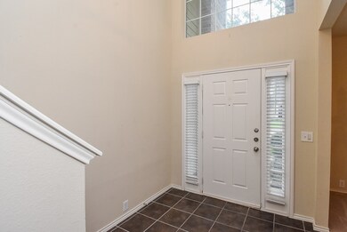 Bright and welcoming entryway with high ceilings,