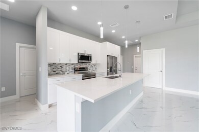 Kitchen featuring stainless steel appliances, ligh