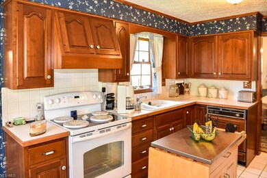 Lovely eat-in kitchen with tile flooring, a pantry