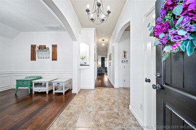 hall from entry, formal dining on left, kitchen on