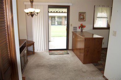 Dining area off kitchen leading out to private pat