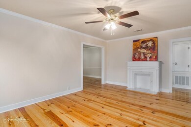 Unfurnished living room featuring hardwood / wood-