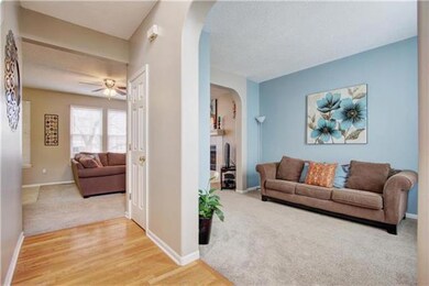 living room on right opens to family room in back