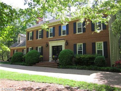 Exterior Front - Large circular aggregate driveway