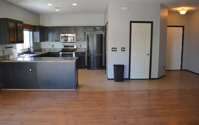 KITCHEN OPENS TO GREAT ROOM