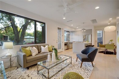Living area with a ceiling fan, healthy amount of