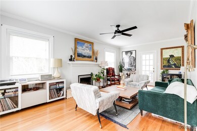 This bright living room features ample space for e