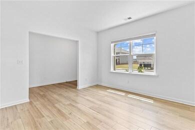 Unfurnished room with light wood-style flooring