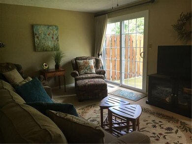 Beautiful living room with window treatments inclu
