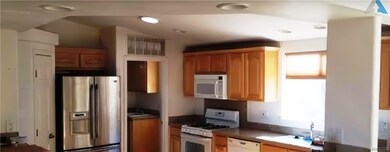 Kitchen featuring refrigerator, dishwasher, microw