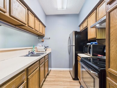 Kitchen featuring appliances with stainless steel