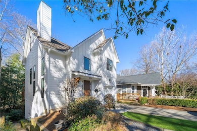 Modern farmhouse style home with driveway, board a
