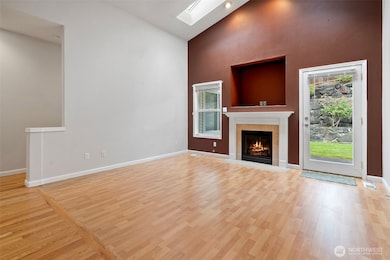 Naturally lit living room with cozy fireplace
