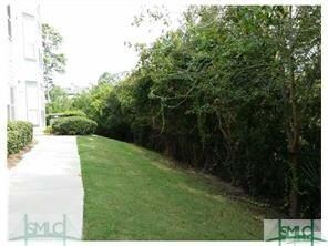 WALKWAY AND SIDE YARD TO THE SECONDARY ENTRANCE FO