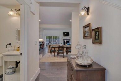 Foyer with peek of Powder Room