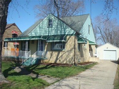 Detached 1.5 car garage with patio off the side.