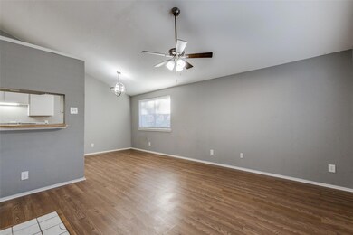 Living room featuring ceiling fan with notable cha