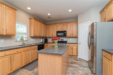 Bright kitchen with lots of cabinet space plus pan