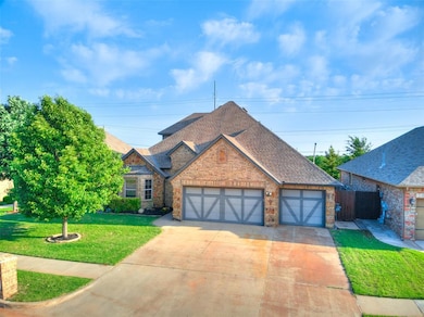 View of front of house with brick siding, roof with shingles, an attached garage, and driveway