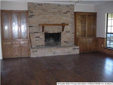Family room with built-ins and wood burning firepl