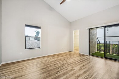 Spare room with high vaulted ceiling, ceiling fan,