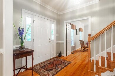 Peak into the living room just off of the foyer. This room would make a guest suite for out-of-town visitors.