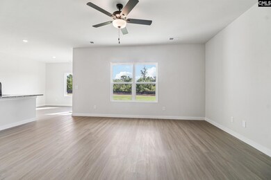 The large family room is located directly off the kitchen, allowing for plenty of room to entertain.