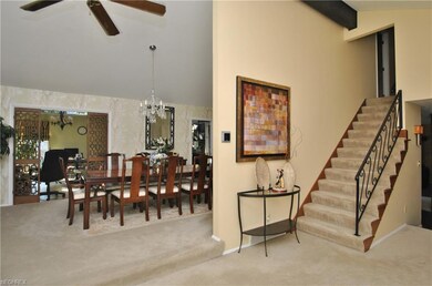 A decorative iron railing and staircase lead to th