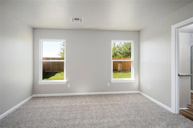 Owner’s retreat with double windows offering views of the backyard and direct access to the ensuite.