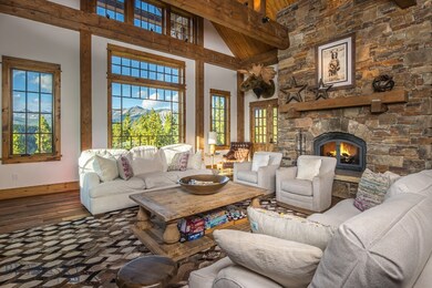 Grand living room with floor to ceiling stone fire