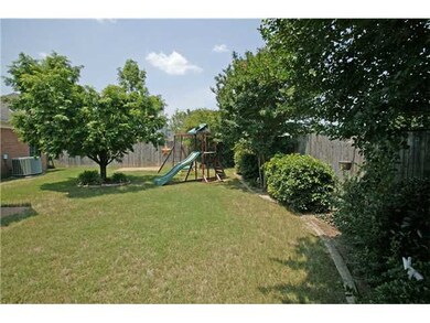 Landscaped backyard has just enough shade and priv