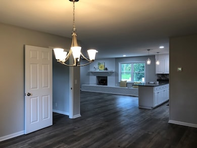 dining looking into family room and kitchen