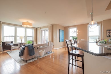 Living room with light wood-type flooring, baseboa