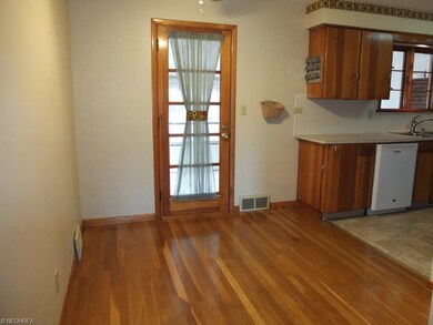 Dining room with hardwood floor.
